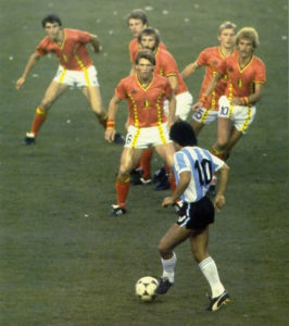 Diego Maradona In Front Of A Bunch Of Belgium Players
